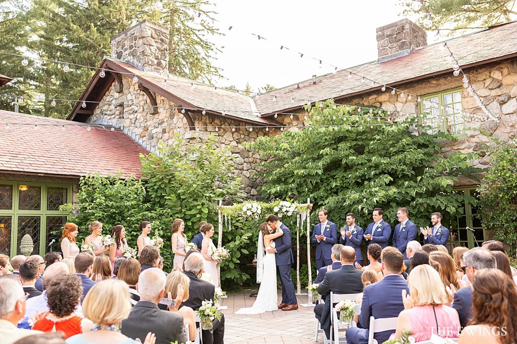 This is an outdoor ceremony at Willowdale Estate, a Topsfield MA wedding venue with historic mansion and estate and tent reception.