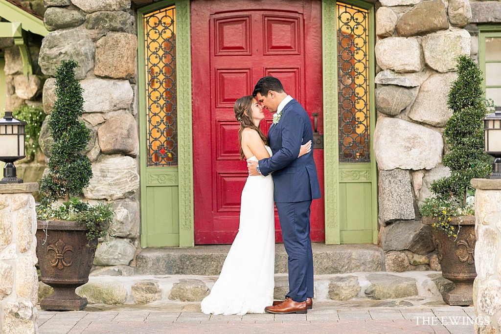 Here is a classic bride and groom picture in front of the red door at Willowdale Estate for their wedding day.