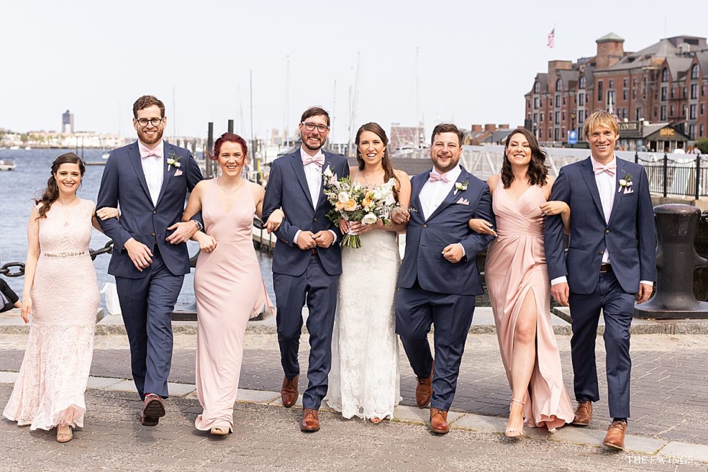 Waterfront wedding party portraits at Christopher Columbus Park in Boston.