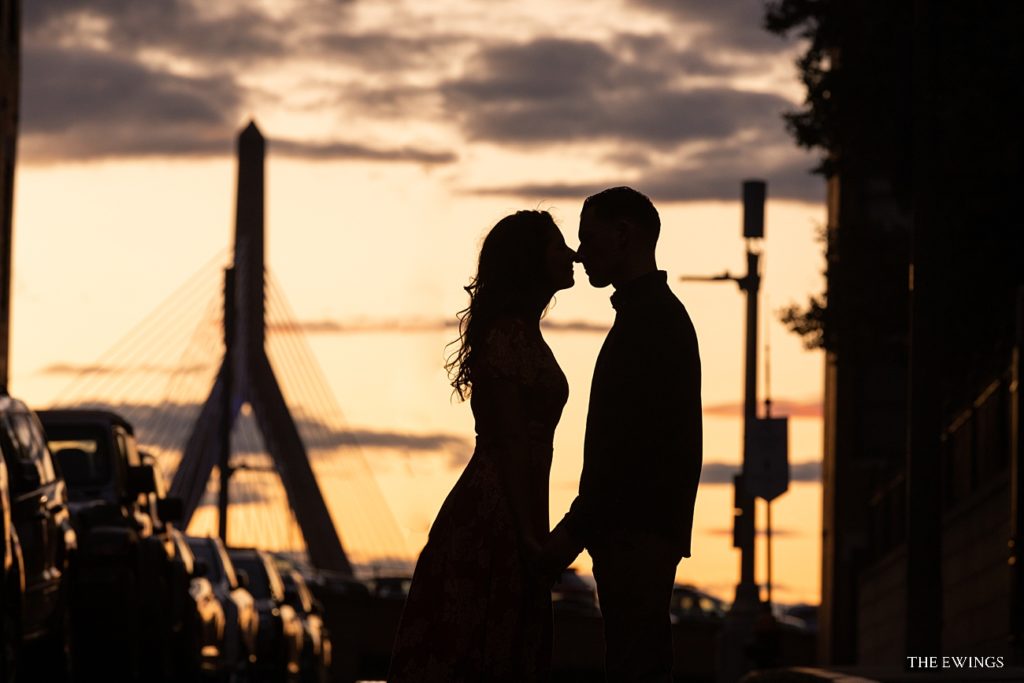 This is a silhouette of a Bride and Groom in Boston's North End with the Zakim Bridge in the background.