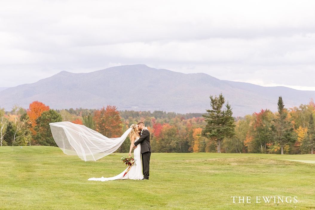 An epic bride and groom portrait with the White Mountains in the background.