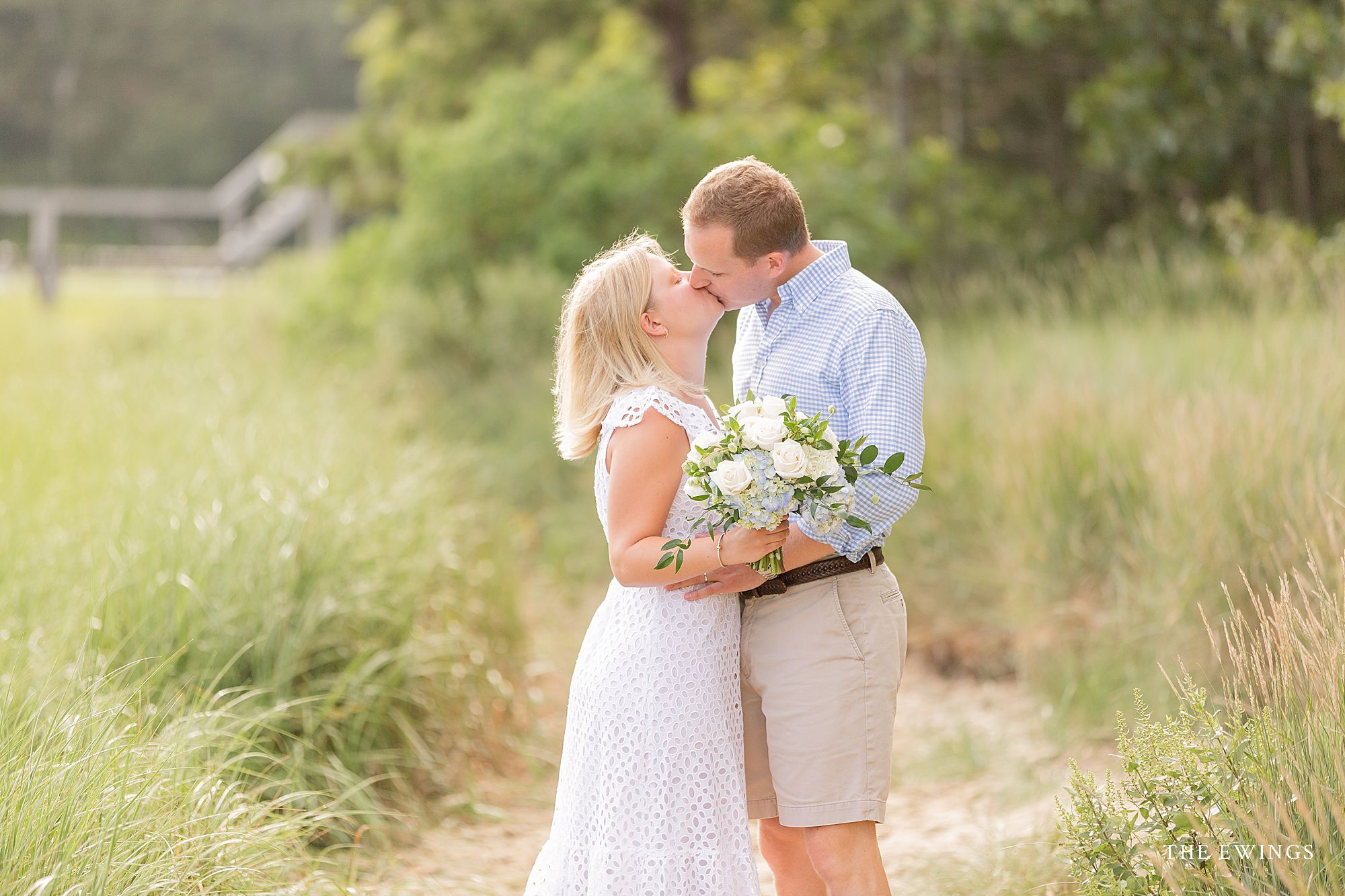 A bride and groom in Cotuit in MA after their Cape Cod elopement wedding ceremony, with light and airy pictures by The Ewings.