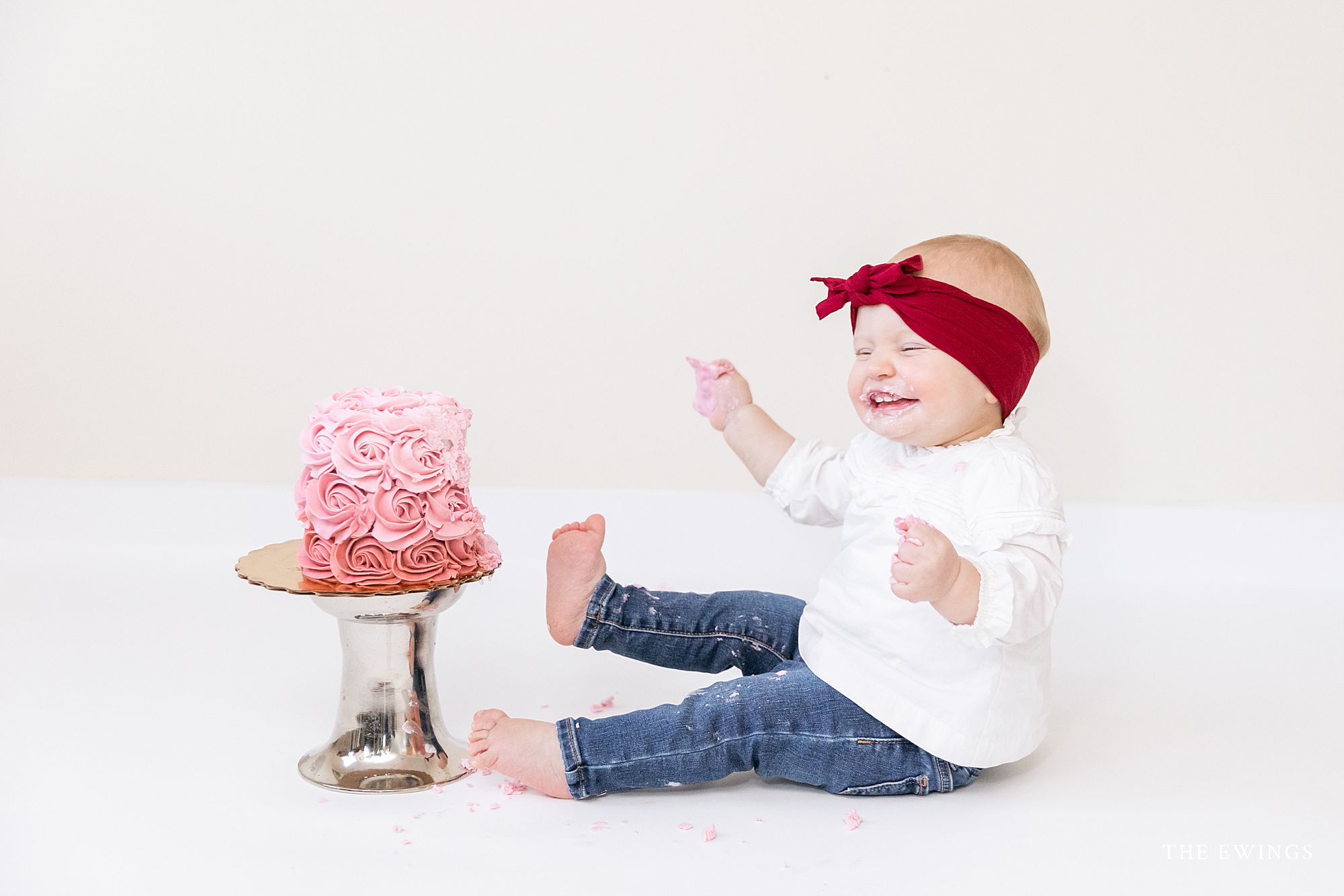 This picture sums up why I love cake smash sessions for one year old babies - their little personalities come out in the best way!