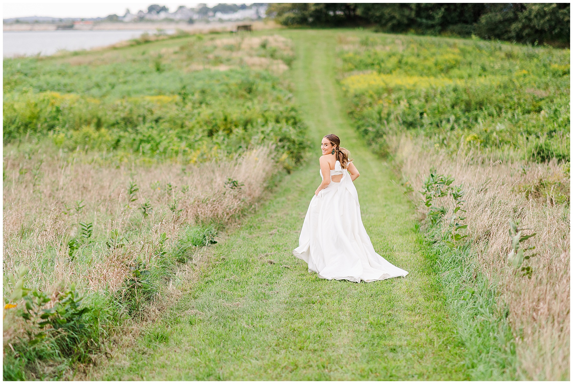 bride running through field Boston