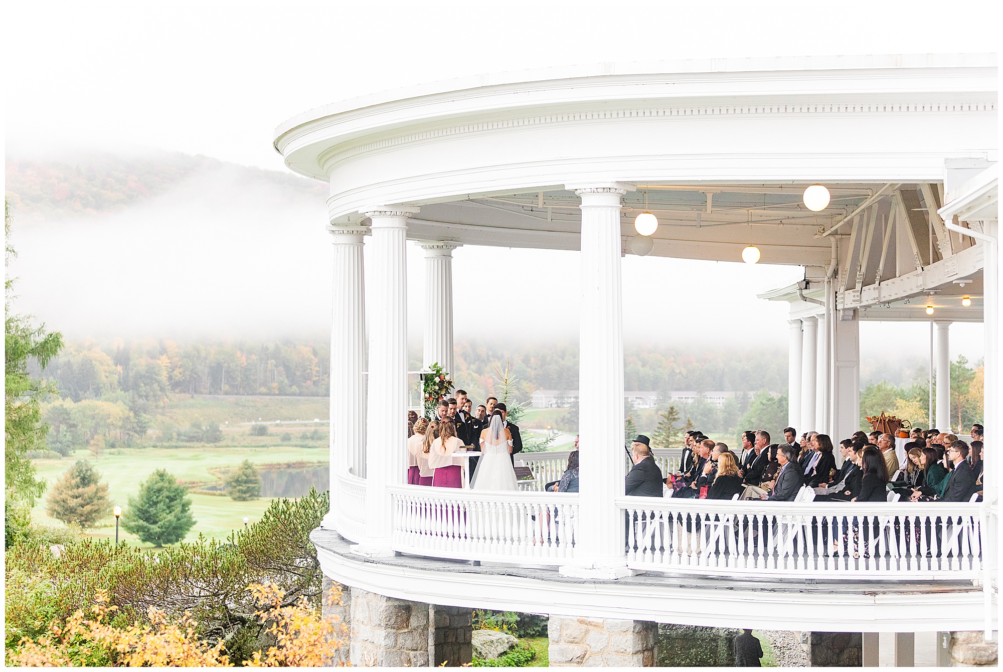 A wedding ceremony on the South Veranda at Mount Washington Resort in the White Mountains of New Hampshire by The Ewings.