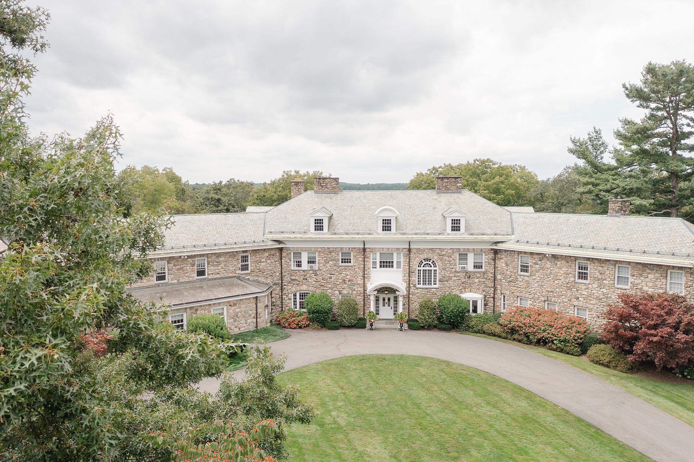 The Connors Center in Dover MA is a gorgeous estate wedding venue with gardens and a tent perfect for anyone looking for a venue with indoor and outdoor spaces, where guests can stay on-property all weekend.