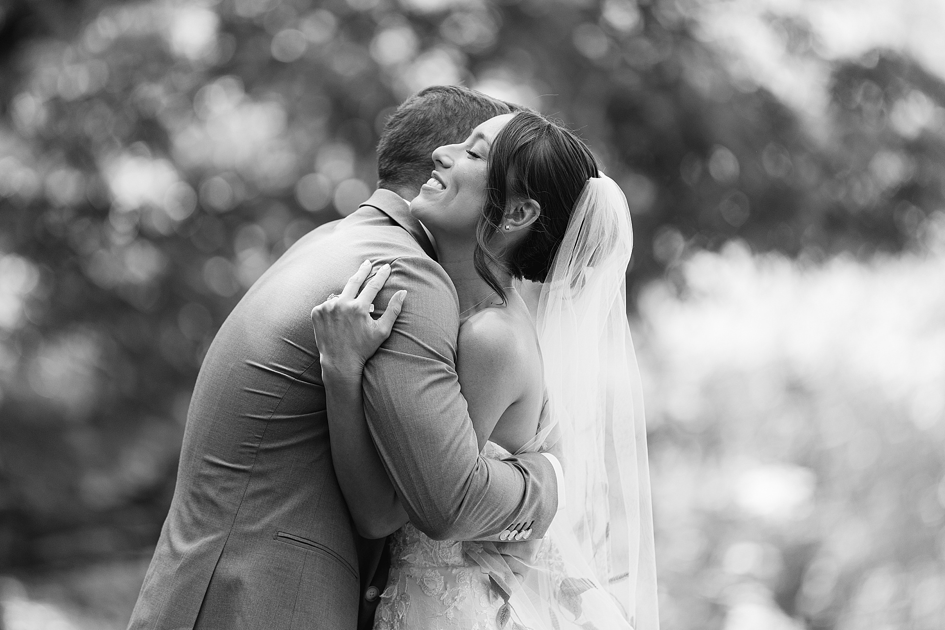 First look for a tent wedding at Lourdes Camp on Skaneateles Lake in the finger lakes region of New York by The Ewings, a luxury wedding photography and videography team